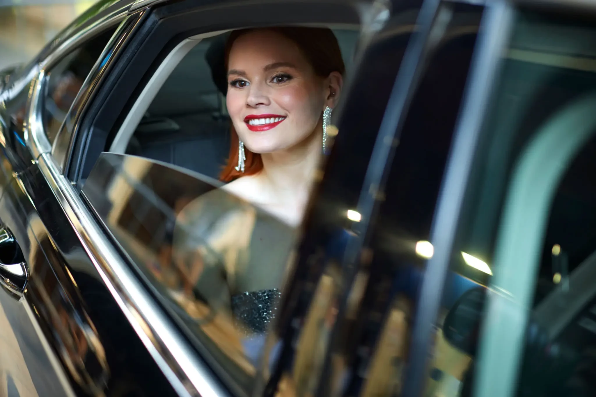 Elegant passenger arriving in a luxury FC Luxs vehicle